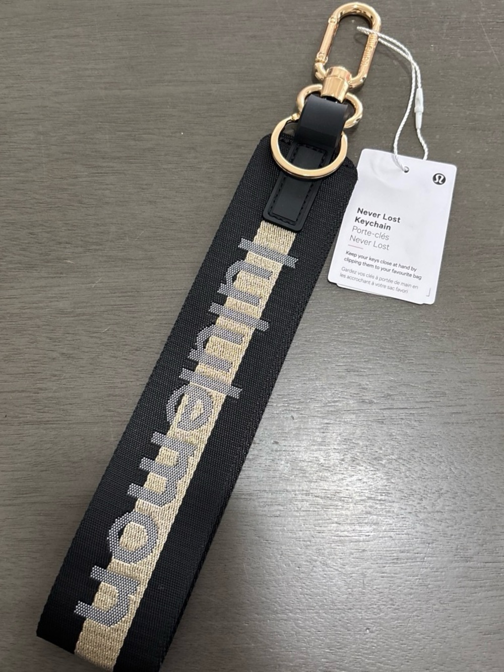 lululemon athletica Black and Gold Never Lost Keychain Wristlet